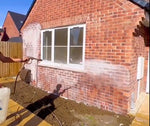 GK Concrete & Grout Residue Remover being applied on a brick wall of a house thumbnail
